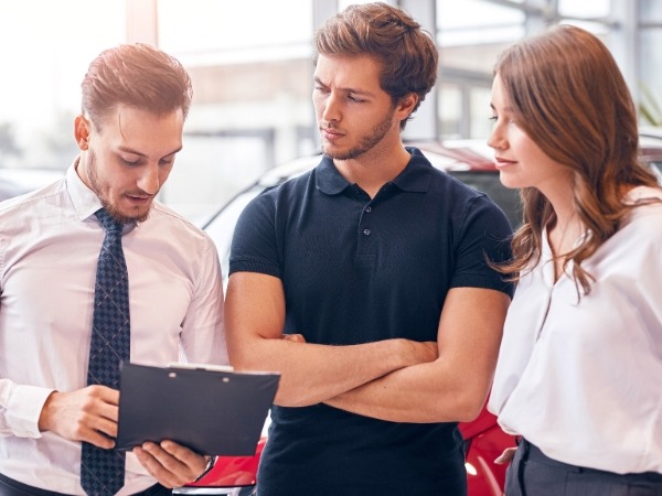 Man and Woman Talking to an Agent