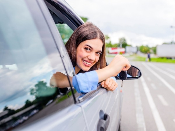 Woman Holding a Car Key