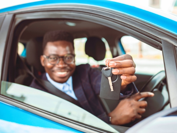 Man Driving a Blue Car